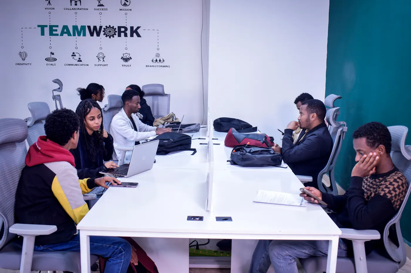 Zulu Tech students celebrating progress at the desk